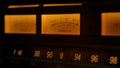 Yellow controls dashboard on an old analog radio. Close up of a scale with an arrow measuring signal power on vintage Royalty Free Stock Photo