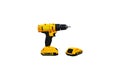 Yellow cordless drill and battery spare isolated