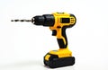 Yellow cordless drill with drill bit is isolated on white background. This power tool is ready for construction, repair, DIY Royalty Free Stock Photo