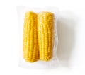 Yellow corn ears packaged and sealed; isolated on white, from above