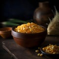 Yellow corn kernels in a bowl on a wooden table. Corn as a dish of thanksgiving for the harvest Royalty Free Stock Photo