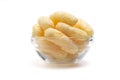 Yellow Corn Puffs in a Glass Bowl Isolated On White Background. Crunchy Flavored Puffed Snacks. Party, Movie, TV, Game Snacks Royalty Free Stock Photo