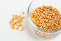 Yellow corn seed for popcorn in a glass bowl Royalty Free Stock Photo