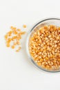Yellow corn seed for popcorn in a glass bowl Royalty Free Stock Photo
