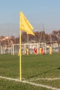 Yellow Corner Flag in Soccer Field during Children League Match Royalty Free Stock Photo