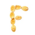 Yellow cornflakes letter F isolated on white background. Alphabet cereal flakes. Royalty Free Stock Photo