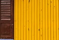 Yellow Corrugated Iron Sheet Wall and Wooden Door