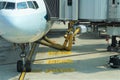 Yellow corrugated lines supply parked airline jet with fuel