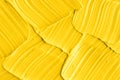 Yellow cosmetic facial mask cream, body scrub texture close up, selective focus. Abstract background with brush strokes