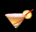 Yellow cosmopolitan cocktail decorated with citrus lemon and red straw Royalty Free Stock Photo