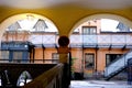 Yellow courtyard arches with columns, historical high-rise building of 19th century with beautiful house vaults, street Helsinki