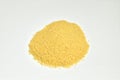 Yellow couscous cereal on a white background.