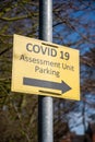 Yellow Covid 19 Assessment Unit Parking sign. Portrait orientation