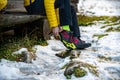 Yellow crampons for shoes before reaching the top. Hiking, traveling, climbing.