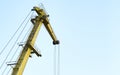 Yellow crane in cargo port translating coal. Industrial scene Royalty Free Stock Photo