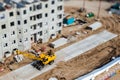 Yellow crane on construction site. Tilt-shift photo Royalty Free Stock Photo