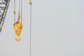 Yellow crane hook at work Royalty Free Stock Photo