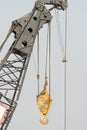 Yellow crane hook at work Royalty Free Stock Photo