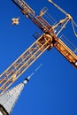 Yellow crane (steeve) and dome with spire of the cathedral