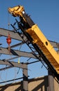 Yellow crane on work site Royalty Free Stock Photo