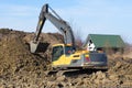 Yellow crawler excavator on work