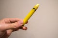 Yellow Crayon in Hand