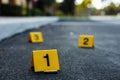 Yellow crime scene markers bullet casing Royalty Free Stock Photo