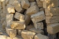 Yellow crimean sawn limestone prepared for construction of building. Traditional porous heat-insulating stone for walls Royalty Free Stock Photo