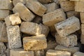 Yellow crimean sawn limestone prepared for construction of building. Traditional porous heat-insulating stone for walls Royalty Free Stock Photo