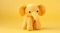 Yellow Crochet Elephant Toy On A Vibrant Background