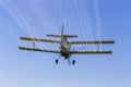 Yellow Crop Duster Spraying Pestisides On Crops