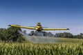 Yellow Crop Duster Spraying Pestisides On Crops