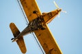 Yellow Crop Dusting Plane Flying in a Blue Sky