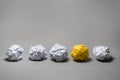 Yellow crumpled paper ball.Business creativity,leadership concept