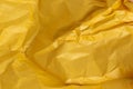 Yellow crumpled sheet of colored paper texture Royalty Free Stock Photo