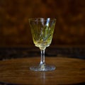 Yellow crystal antique engraved shot glass close-up. Royalty Free Stock Photo