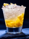 Yellow cube ice of cold drink with pineapple on