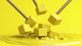 Yellow cubes falling into yellow liquid, studio shot Royalty Free Stock Photo