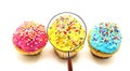 Yellow cupcake view through magnifying glass Royalty Free Stock Photo