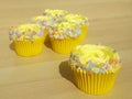 Yellow cupcakes with sprinkles