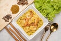 Yellow curried rice with shrimp, Yellow rice prawn biryani with green coriander sauce Royalty Free Stock Photo