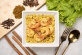 Yellow curried rice with shrimp, Yellow rice prawn biryani with green coriander sauce Royalty Free Stock Photo