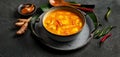 Yellow curry with chicken in bowl on dark background Royalty Free Stock Photo