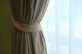 Yellow curtains are tied. Near the white curtain. Royalty Free Stock Photo