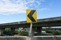 Yellow curve warning sign on side of express high way Royalty Free Stock Photo