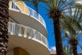 Yellow Curved Balconies by Palm Trees