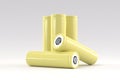 5 yellow cylindrical batteries on a light gray background. Storage battery or secondary cell. Rechargeable li-ion