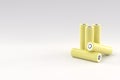 5 yellow cylindrical batteries on a light gray background. Storage battery or secondary cell. Rechargeable li-ion