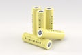 5 yellow cylindrical lithium-ion batteries type 18650 on a light gray background. Rechargeable batteries for electrical