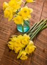 Yellow dafodills on wooden table